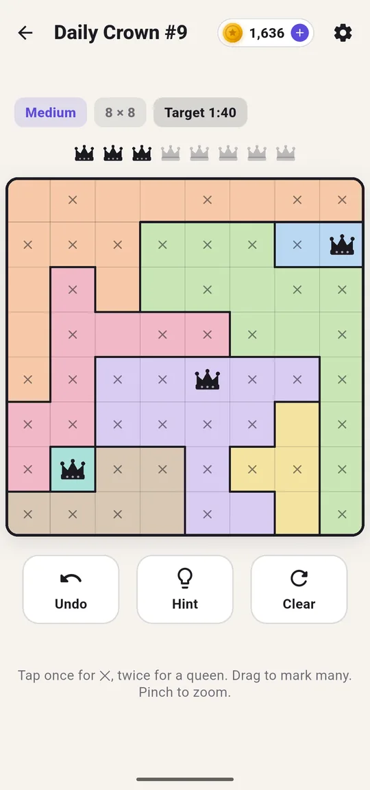 A Daily Crown board half solved, with queens and crosses on coloured regions